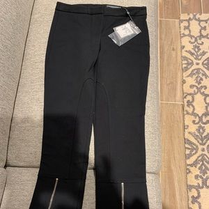 Alexander McQueen black crop pants with zip accent.